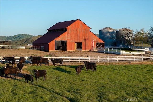 exterior space with a mountain view and a rural view