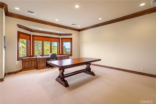 office area featuring baseboards, visible vents, and light colored carpet