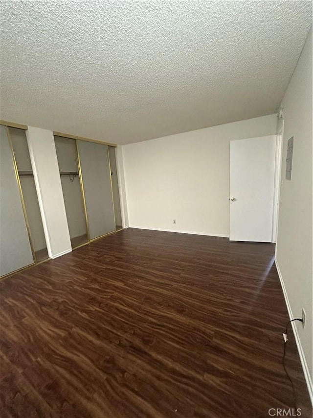 1524 Acacia St Unit 3, Alhambra, CA 91801 - unfurnished bedroom with multiple closets, a textured ceiling, and dark wood-style floors