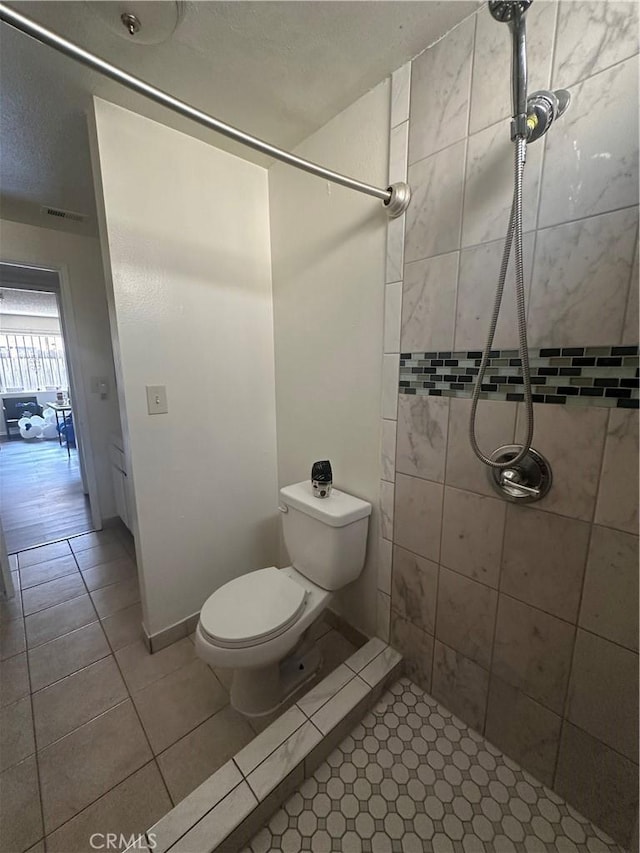 1524 Acacia St Unit 3, Alhambra, CA 91801 - bathroom featuring a tile shower, toilet, and tile patterned floors