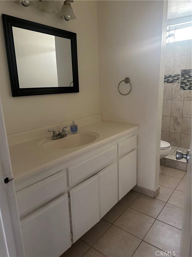 1524 Acacia St Unit 3, Alhambra, CA 91801 - bathroom featuring tile patterned floors, vanity, toilet, and tiled shower
