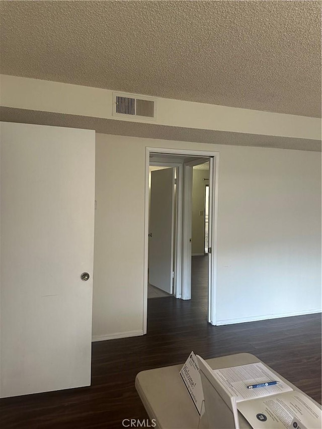 1524 Acacia St Unit 3, Alhambra, CA 91801 - spare room with dark wood-style floors, baseboards, and a textured ceiling