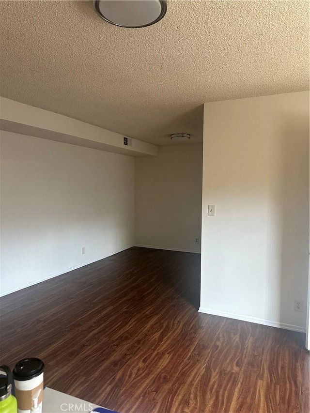 1524 Acacia St Unit 3, Alhambra, CA 91801 - unfurnished room featuring a textured ceiling and dark wood-style flooring