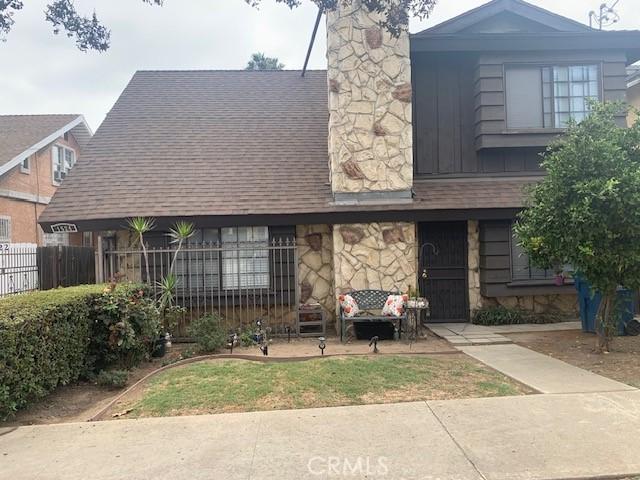 1524 Acacia St Unit 3, Alhambra, CA 91801 - view of front of home featuring stone siding, a chimney, and a shingled roof