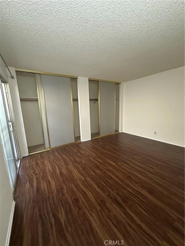 1524 Acacia St Unit 3, Alhambra, CA 91801 - unfurnished bedroom featuring two closets, wood finished floors, and a textured ceiling