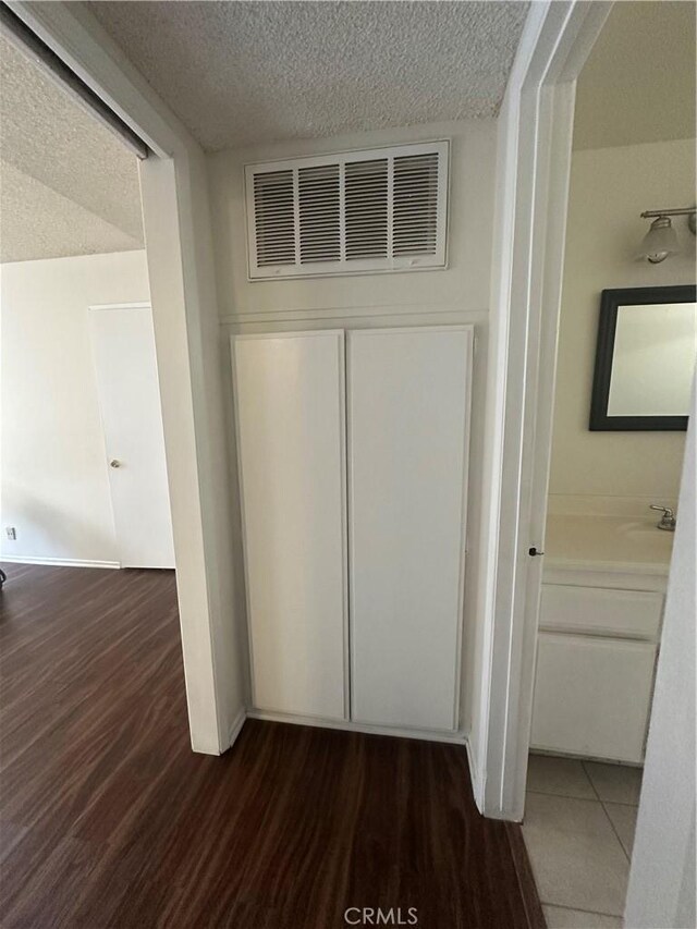 1524 Acacia St Unit 3, Alhambra, CA 91801 - detailed view of a textured ceiling, wood finished floors, and a sink
