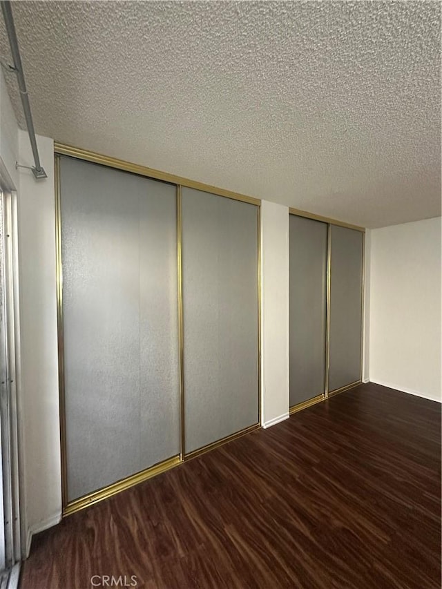1524 Acacia St Unit 3, Alhambra, CA 91801 - unfurnished bedroom with a textured ceiling and multiple closets