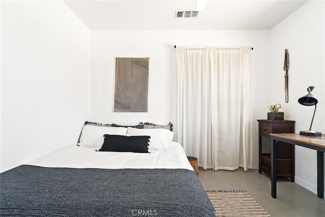 7073 Mission Ave Unit 29, Palms, CA 92277 - bedroom featuring finished concrete floors and baseboards
