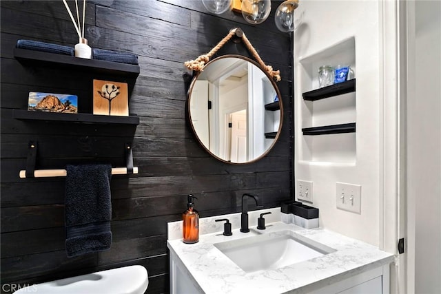 7073 Mission Ave Unit 29, Palms, CA 92277 - half bathroom with vanity and wood walls