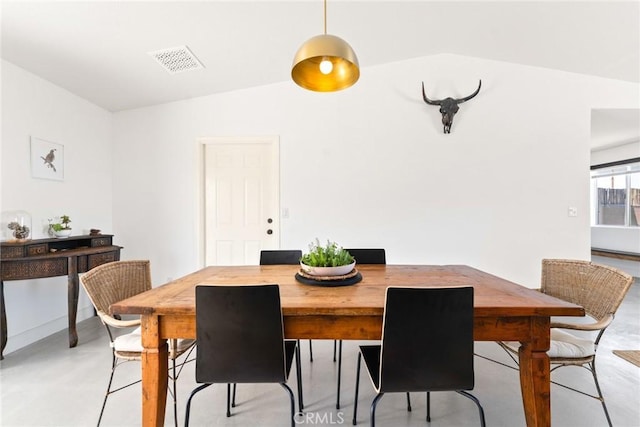 7073 Mission Ave Unit 29, Palms, CA 92277 - dining room featuring vaulted ceiling and finished concrete flooring