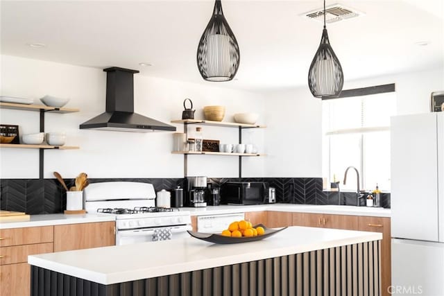 7073 Mission Ave Unit 29, Palms, CA 92277 - kitchen featuring wall chimney exhaust hood, open shelves, white appliances, and modern cabinets