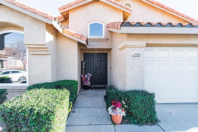 12325 Atoka Ln, Victorville, CA 92392 - doorway to property featuring a tiled roof and stucco siding