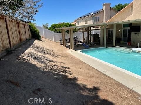 12325 Atoka Ln, Victorville, CA 92392 - view of pool featuring a patio area and a fenced backyard