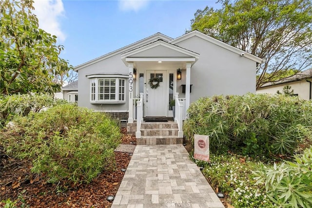 view of front of house featuring stucco siding