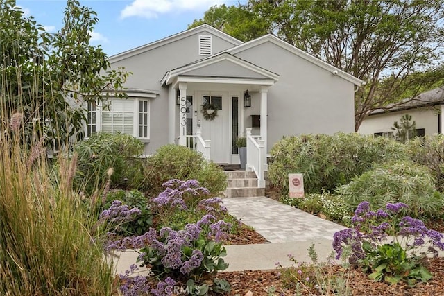 view of front of house featuring stucco siding