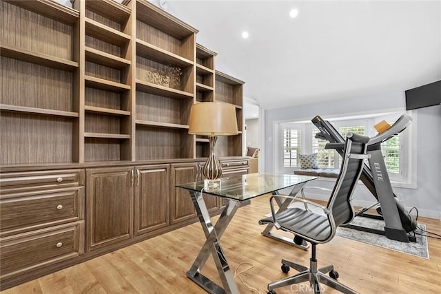 unfurnished office with baseboards, light wood-style flooring, and recessed lighting