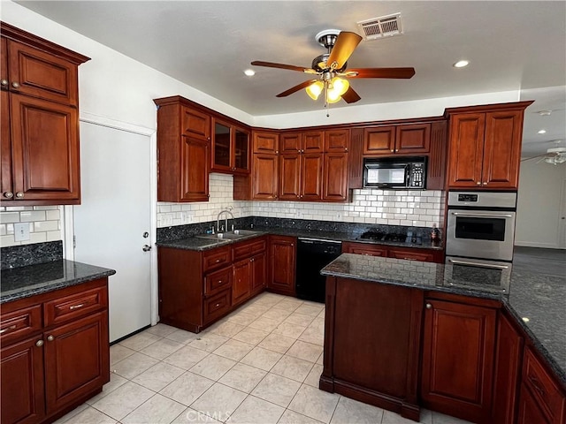 kitchen featuring visible vents, ceiling fan, a sink, black appliances, and backsplash