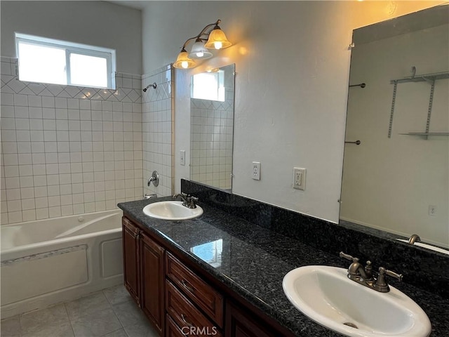 full bathroom with tile patterned floors, a sink, double vanity, and bathing tub / shower combination