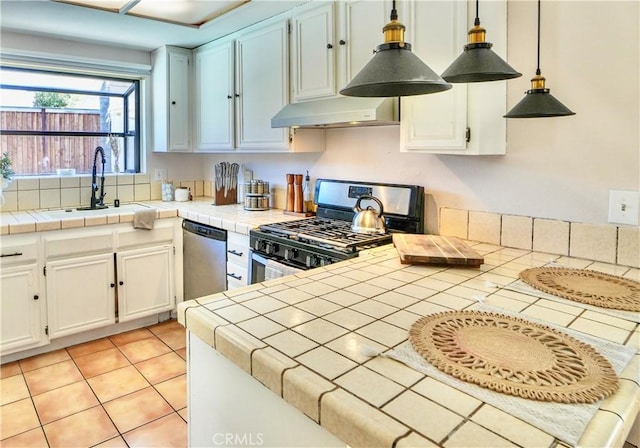 3710 Colonial Cir, Lake Elsinore, CA 92530 - kitchen featuring tile countertops, a sink, appliances with stainless steel finishes, and under cabinet range hood