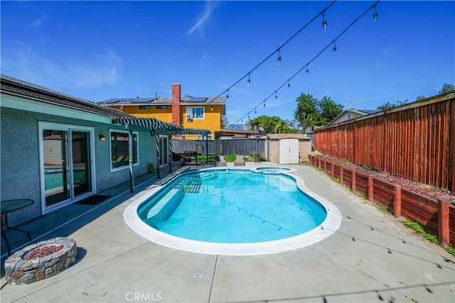 3710 Colonial Cir, Lake Elsinore, CA 92530 - view of swimming pool featuring an outbuilding, a storage shed, a fenced backyard, and a patio area