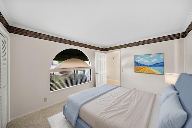 bedroom with crown molding and carpet flooring