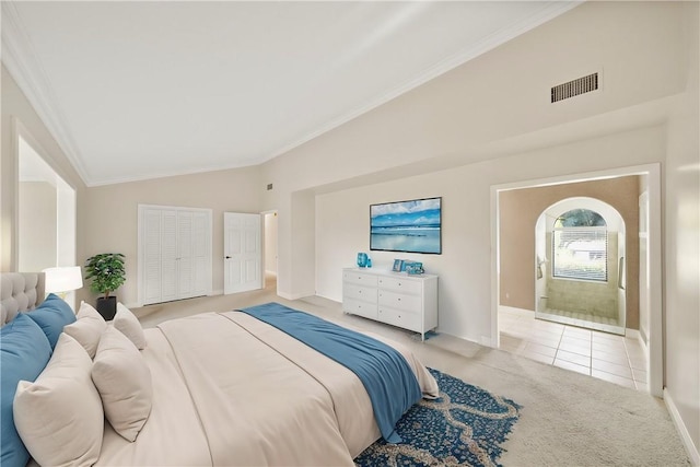 bedroom with crown molding, carpet floors, visible vents, lofted ceiling, and baseboards