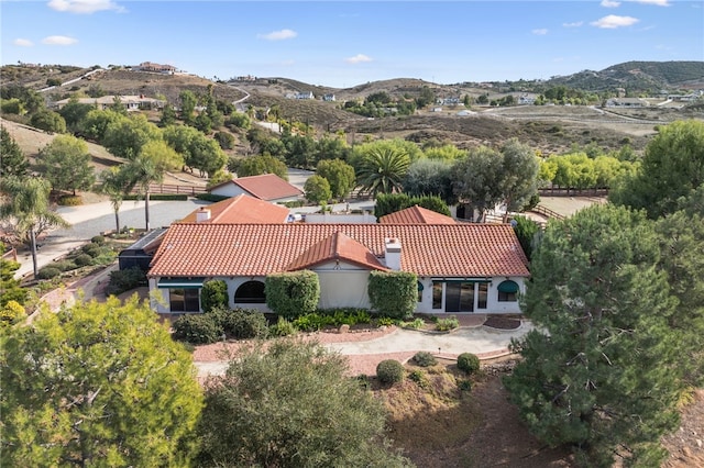 birds eye view of property with a mountain view