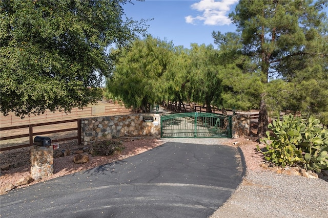 view of gate featuring fence