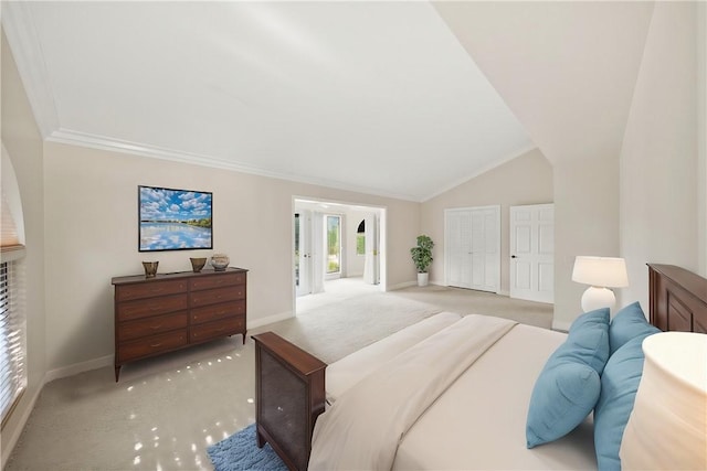 bedroom with baseboards, ornamental molding, carpet flooring, and lofted ceiling