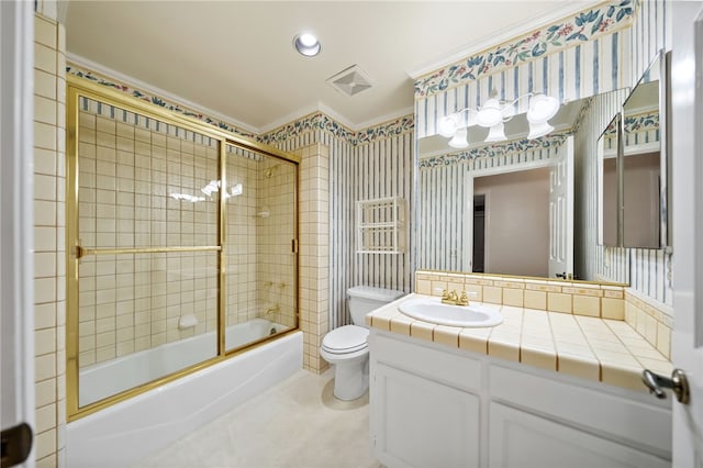 full bath with shower / bath combination with glass door, vanity, toilet, wallpapered walls, and ornamental molding
