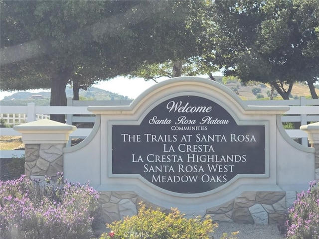 community sign with fence