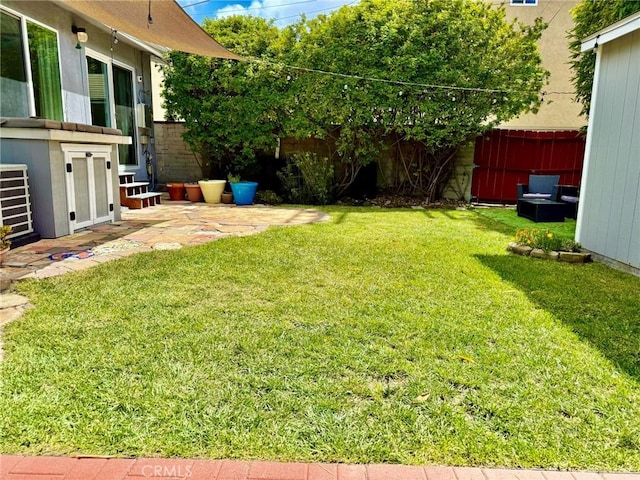 view of yard with fence private yard and a patio