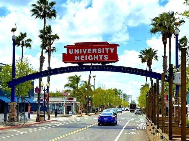 2019 Meade Ave, San Diego, CA 92116 - view of asphalt street with street lighting, curbs, traffic lights, and sidewalks