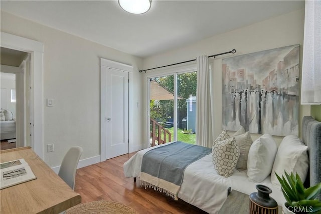 2019 Meade Ave, San Diego, CA 92116 - bedroom with wood finished floors, access to exterior, and baseboards