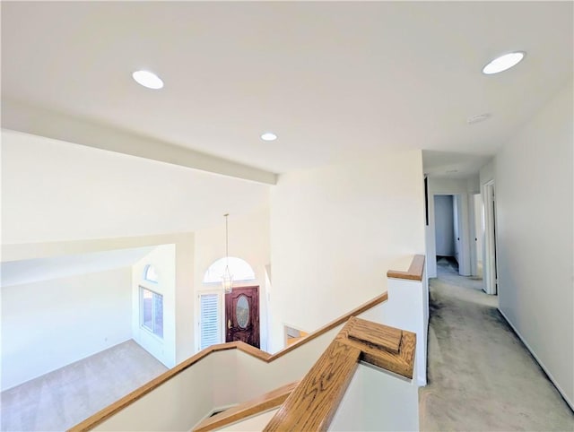 corridor featuring an upstairs landing, recessed lighting, vaulted ceiling with beams, and light carpet