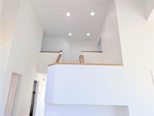 staircase with recessed lighting