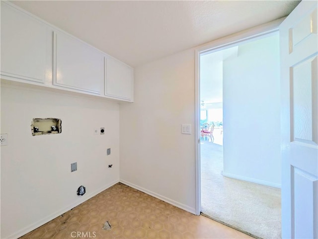 laundry area featuring light floors, electric dryer hookup, baseboards, cabinet space, and hookup for a washing machine