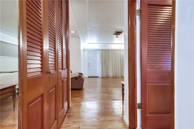 hall with light wood-type flooring