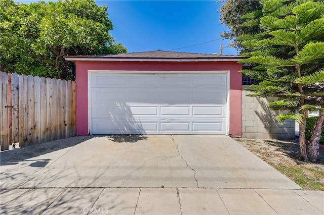 garage featuring fence