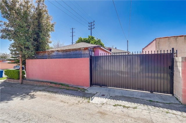 view of gate featuring fence