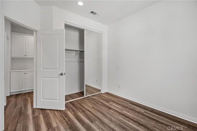 6991 Cottonwood Ln, Buena Park, CA 90621 - unfurnished bedroom with wood finished floors, a closet, and recessed lighting