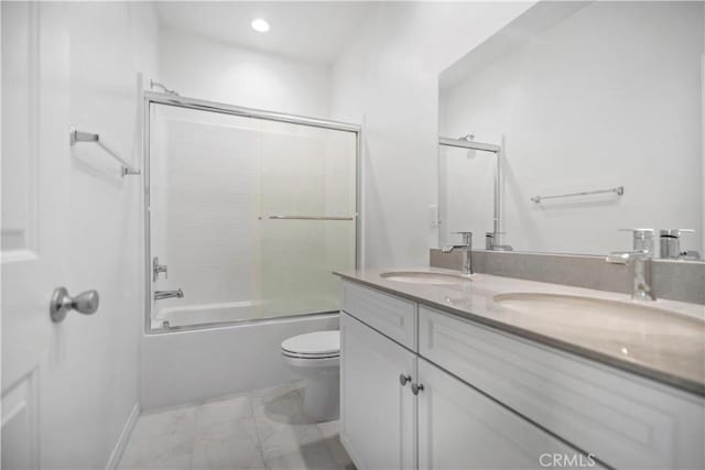 6991 Cottonwood Ln, Buena Park, CA 90621 - full bath with double vanity, enclosed tub / shower combo, recessed lighting, and marble look tile flooring