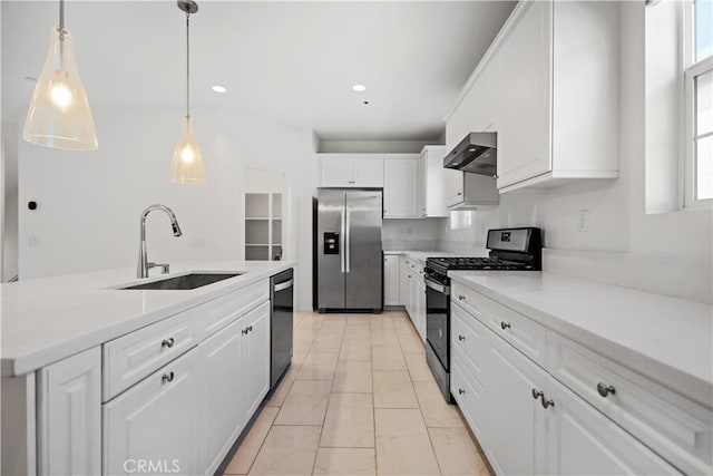 6991 Cottonwood Ln, Buena Park, CA 90621 - kitchen featuring appliances with stainless steel finishes, wall chimney range hood, white cabinetry, light marble finish flooring, and light countertops