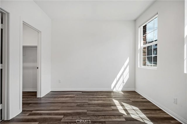 6991 Cottonwood Ln, Buena Park, CA 90621 - unfurnished bedroom with dark wood-type flooring and a closet