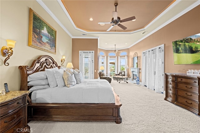 carpeted bedroom featuring recessed lighting, a raised ceiling, visible vents, ornamental molding, and access to outside