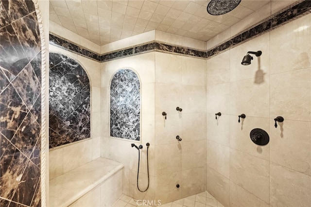bathroom featuring tiled shower