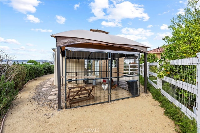 view of outdoor structure featuring an outdoor structure and fence