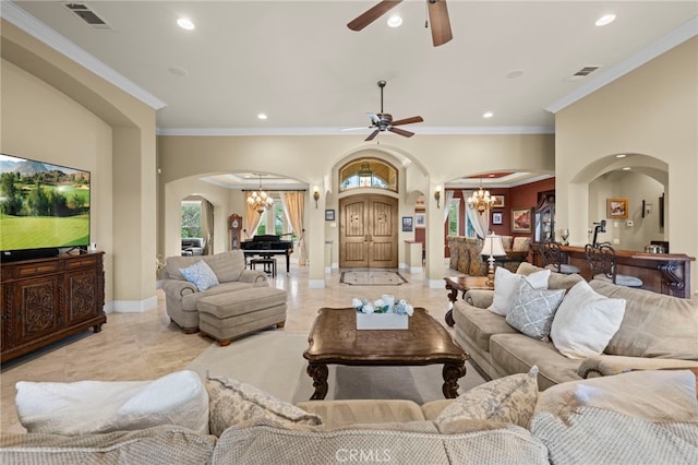 living room featuring arched walkways, ceiling fan with notable chandelier, and recessed lighting