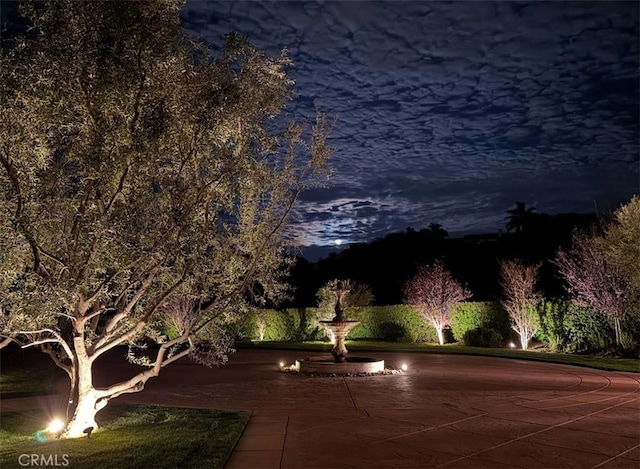 view of yard at twilight