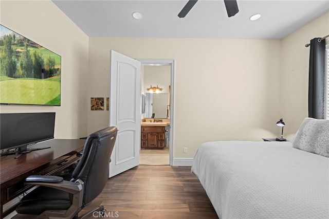 bedroom featuring a sink, ceiling fan, dark wood-style floors, recessed lighting, and connected bathroom